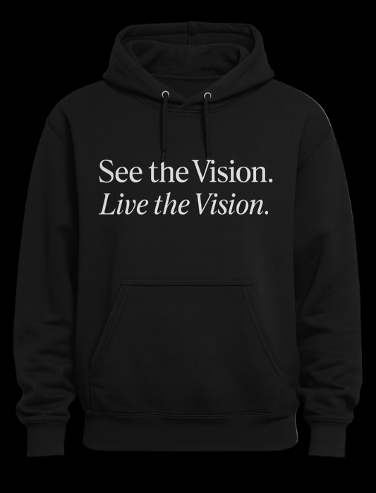 Black hoodie with text 'See the Vision. Live the Vision.' on a light gray background